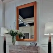 Elegant Bellavista Ophelia wall mirror with solid lime wood and warm bronze-toned metallic finish creates architectural presence