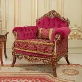 Lavish Modenese Rubino Delight lounge chair upholstered in ruby-red velvet with gold damask and gilded hand-carved wood frame