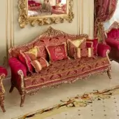 Lavish Modenese Rubino Delight sofa upholstered in ruby-red patterned fabric with gold embroidery and gold leaf detailing