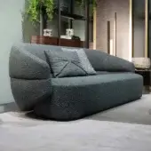 Distinguished Zanaboni Alma sofa crafted in textured bouclé weave with a muted dark gray-blue tone and refined grey stained ash wood base