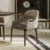 Avant-garde Zanaboni Addison armchair handcrafted with black and white patterned textile and walnut-stained ash wood base