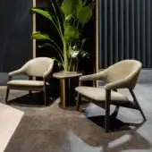 Exceptional Zanaboni Egle lounge chair crafted with neutral beige leather upholstery and satin dark brown wood frame