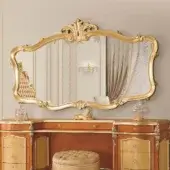 Distinguished Modenese Royal Blend wall mirror crafted in wood with gilded metal detailing and ornate sculpted floral motifs