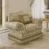 Sumptuous Modenese Royal Blend lounge chair with gold and cream patterned textile upholstery and satin wood frame