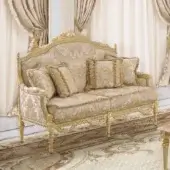 Lavish Modenese Imperial Majesty sofa crafted in Italy with ivory wood and gold leaf accents, upholstered in cream and gold damask fabric