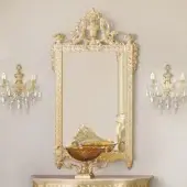 Superior Modenese Imperial Majesty mirror crafted in wood with high-gloss gold coating and ornate sculpted floral motifs
