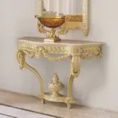Exquisite Modenese Imperial Majesty console crafted in ivory with lavish gold leaf detailing and curved lines