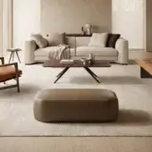 Distinguished Borzalino Franklin ottoman crafted in medium brown leather with elegant gros-grain trimming and lacquered wood feet