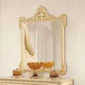 Lavish Modenese Golden Radiance mirror crafted in Italy with a wood frame and glossy golden finish exhibiting ornate floral motifs