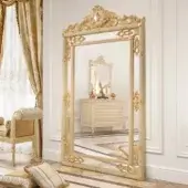 Lavish Modenese Golden Radiance Grand Mirror crafted in wood with golden finish and ornate floral detailing