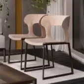 Distinguished Giorgetti Gea chair with a geometric stainless-steel frame powder-coated in carob and a birch plywood seat