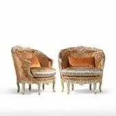 Distinguished Armando Rho A1243 lounge chair with golden-orange textile upholstery and radiant gold leaf finish