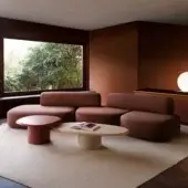 Distinguished Carpanese Home Slow sectional with soft terracotta textile upholstery and exposed ash wood supports