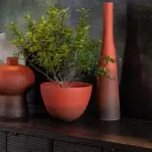 Distinguished Rina Menardi Ciotole bowls crafted from baked clay with a warm terracotta hue and visibly textured matte finish