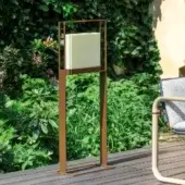 Distinguished Giorgetti Gea floor lamp with carob painted steel frame and sophisticated onyx diffuser emitting a warm glow