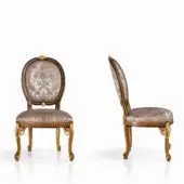 Exquisite Armando Rho 1205 chair handcrafted in walnut-tone with gold leaf accents and patterned beige brown upholstery