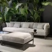 Elegant Giorgetti Aldìa sofa with pewter finish metal and natural tone reconstituted birch plywood, upholstered in textured waterproof fabric