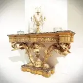 Exquisite Riva Mobili D'Arte 9055 console crafted in lustrous gold tone with carved floral details and dark marble-like tabletop