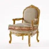 Exquisite Riva Mobili D'Arte 6823 lounge chair built with floral carved wood and patterned beige upholstery with peach trim
