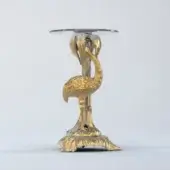 Exceptional Riva Mobili D'Arte 1320 side table crafted in Italy with sculpted bird support and circular glass surface in gleaming gold
