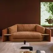 Superior Black Tie Lilith sofa with earthy brown bouclé textile and smooth satin-like brown wood frame