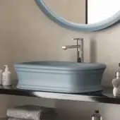 Elegant Norah Design ARBA 02 washbasin with sculpted form in muted blue-grey Norahcryl solid surface and velvety matte finish