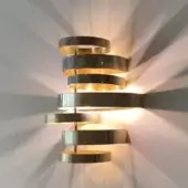 Elegant Black Tie Olly wall lamp crafted in stainless steel with a muted silver-gray finish and subtle golden undertones