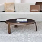 Distinguished Capital Omega coffee table with dark marble tabletop and reddish-brown curved wooden legs