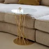 Distinguished Black Tie Tao side table with clear glass top and delicately sculpted stainless steel base in golden finish