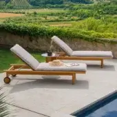 Exceptional Atmosphera Panama lounger with warm medium-toned brown teak wood and satin finish slatted surface