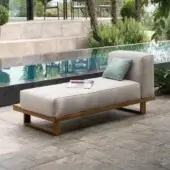 Refined Atmosphera 9.Zero chaise lounge in solid Asian Teak with satin finish and woven textile, accented with a muted teal cushion