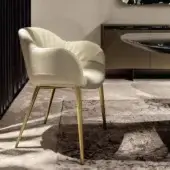 Exclusive Tonin Casa Olympia armchair upholstered in creamy off-white textile with polished golden metal legs and quilted backrest