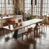 Distinguished Riva 1920 Bedrock Plank table crafted with a monumental warm medium-brown solid wood tabletop and sculptural dark gray metal base
