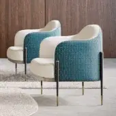 Refined Capital Oxford lounge chair upholstered in patterned teal and brown textile with brass and dark gray metal legs crafted in Italy