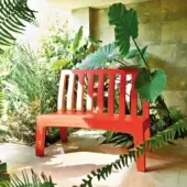 Superior Serralunga Romeo bench with vibrant red recyclable LLDPE construction and gently curved slatted backrest