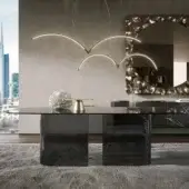 Elegant Tonin Casa Millerighe table with a ribbed cast glass tabletop and glossy dark-toned legs
