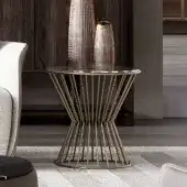 Distinguished Capital Khero side table with a sleek round glass top and intricately designed golden metallic base crafted in Italy with a glossy finish