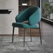 Lavish Tonin Casa Astra armchair with softly curved silhouette and muted teal fabric upholstery with matte metal base