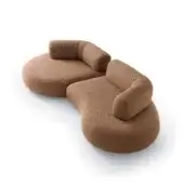 Sleek Ditre Italia Isla sofa with kidney‑shaped modules, warm brown‑terracotta fabric, quilted leather backrest and fir wood frame
