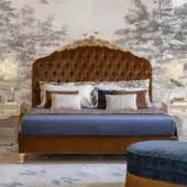 Sophisticated Bellotti Ezio double bed in chestnut‑tone textile with plush headboard, gold‑accented crest and gilded legs