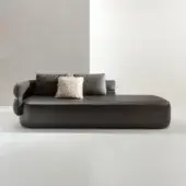 Elegant Laurameroni Duetto chaise in espresso leather with liquid metal tin profile, beige shag pillow, low‑profile curved