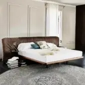 Distinguished Cattelan Italia Marlon bed with textured brown fabric upholstery and Canaletto walnut frame finished in dark stained wood grain