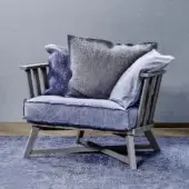 Exquisite Gervasoni Gray 07 lounge chair with blue textile cushions and matte solid wood cross-shaped base