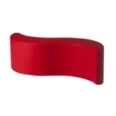 Elegant Slide Wave bench in solid red polyethylene featuring an organic serpentine form and semi matte finish