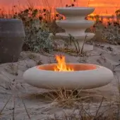 Exquisite PIMAR Capasa fire pit featuring minimalist natural stone carved construction in matte off-white