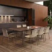 Exceptional Roberti Rattan Portofino table with extendible HPL top and corten finish built with stainless steel and aluminum