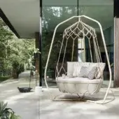 Exceptional Roberti Rattan Gravity lounge chair with stainless steel frame and plush cushions in neutral hues
