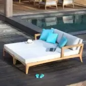 Distinguished Royal Botania Zenhit lounger with teak wood structure and comfortable cushions in light fabric with cyan blue accents