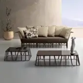 Elegant Roberti Rattan Hamptons Graphics coffee table with dark powder-coated aluminum and lacquered glass top