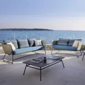 Superior Roberti Rattan Portofino sofa with tan Nautic Rope and light blue outdoor fabric cushions crafted with a powder-coated aluminum frame